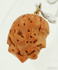 Handmade peach pit pocket watch chain fob in the shape of a man in a football helmet