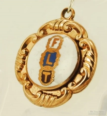 YGF shield fob with Odd Fellows "FLT" logo