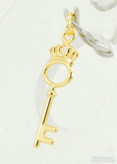 YBM skeleton key-shaped pocket watch chain fob with an open top, stylized crown, and connector loop