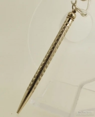 WBM pencil pocket watch chain fob, engraved with chevron and vertical line designs