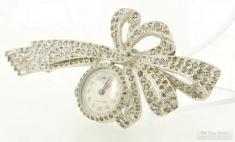 Gotham 19mm 7J grade SLKI #20272 ladies' brooch watch, WBM case and bow brooch with crystals, boxed