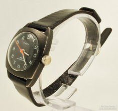 Timex 1J ladies' wrist watch, handsome black gunmetal base metal and SS cushion-shaped case