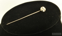 Silver-plated round stick pin with a stylized "X" design, silver-plated pin stopper