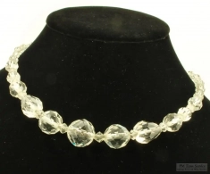 17.5" graduated bead cut glass-bead necklace, brass diamond-shaped clasp with filigree cut-outs