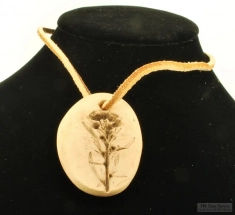 Handmade ceramic flower pendant with a suede leather necklace, recessed design of a blooming flower